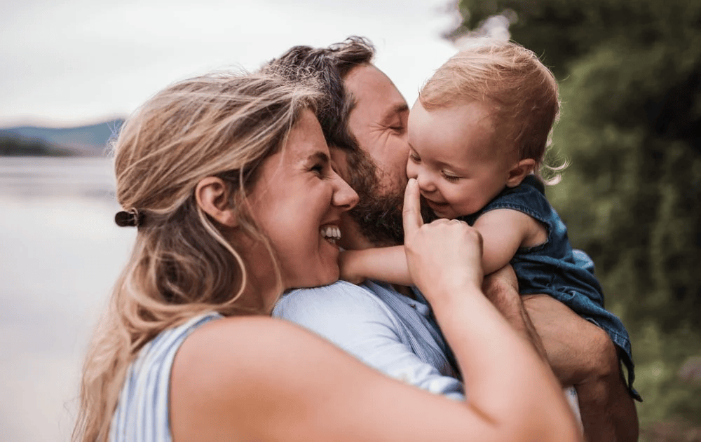 A young family with a toddler girl outdoor