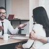 A mortgage broker explains a couple's options to them