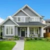 Grey house green lawn
