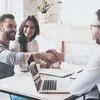A man shakes hands with a mortgage broker