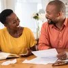 A middle-aged couple looks at their options for paying off their mortgage