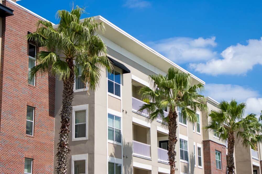 palm trees outside of florida condo_ should you sell your American vacation home