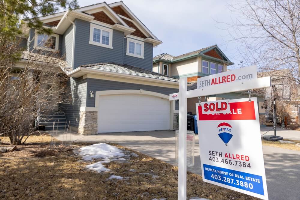 Calgary, Alberta, Canada. March 24, 2022. A REMAX Realtor Sign of a Sold property during winter