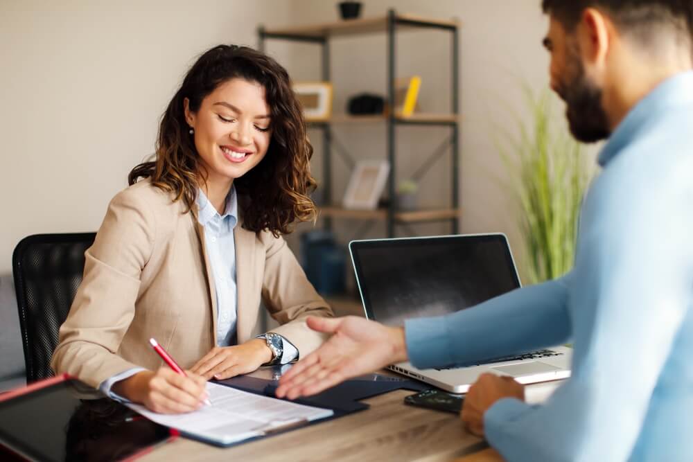 What is a certificate of insurance Young woman signing contract