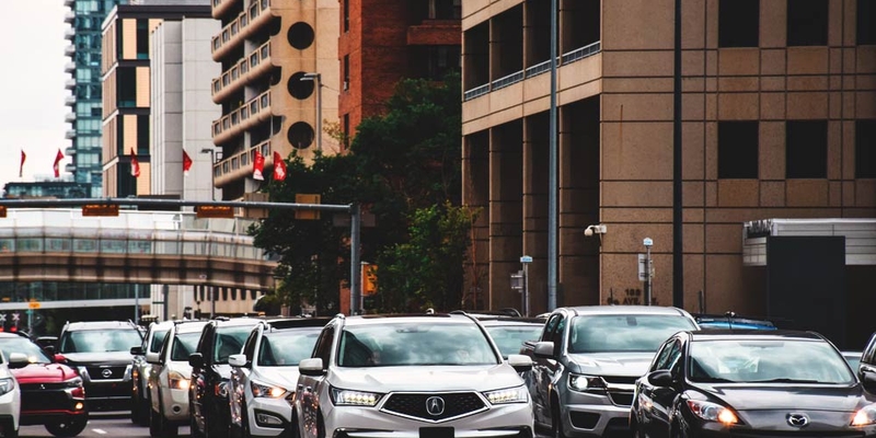 cars driving downtown in the city