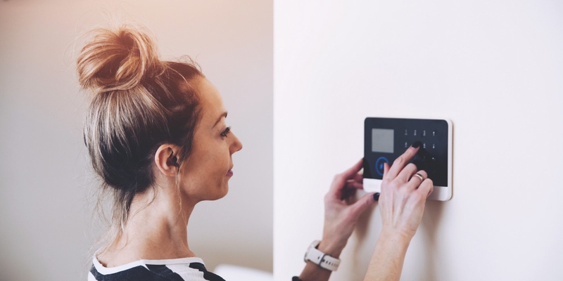 woman setting security system