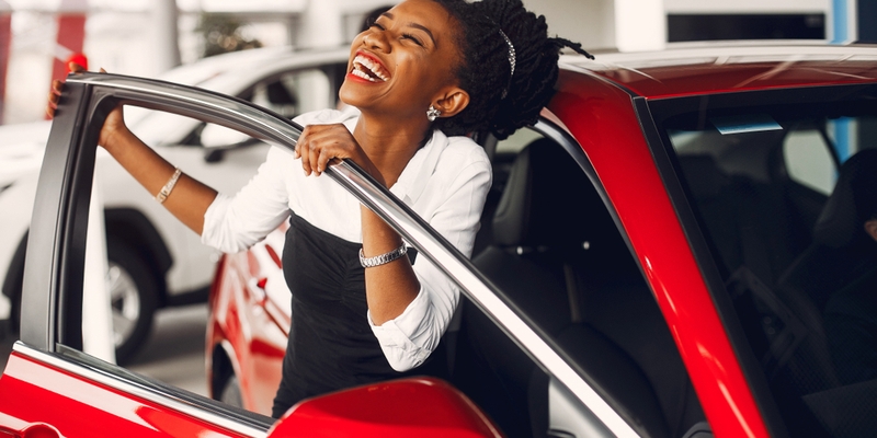 Woman buying the car. Lady in a car salon..jpg