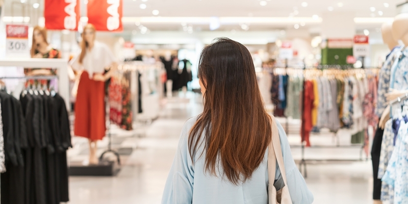 young asian woman shopping in a department store