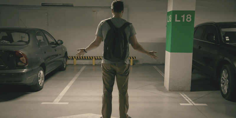 man finding out his car has been stolen